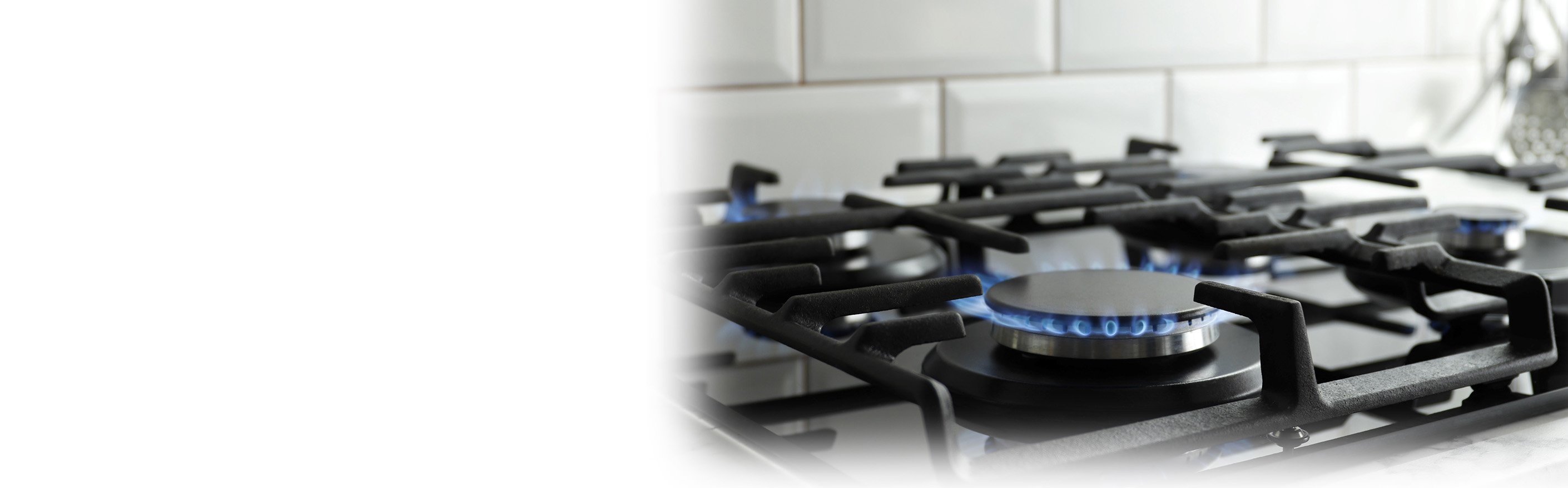 natural gas range with flame in kitchen