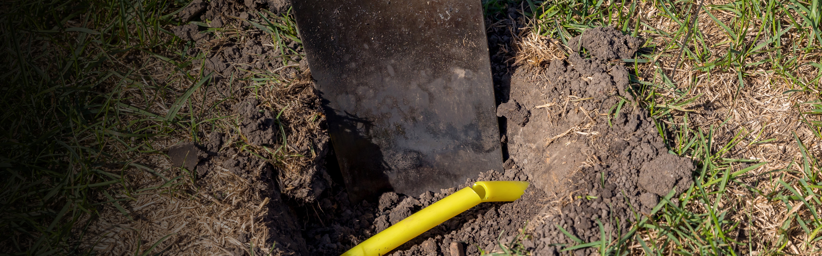 shovel digging into ground